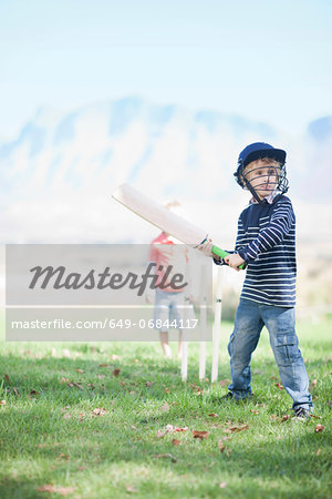 Boys playing cricket