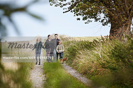 Family walking together on rural road