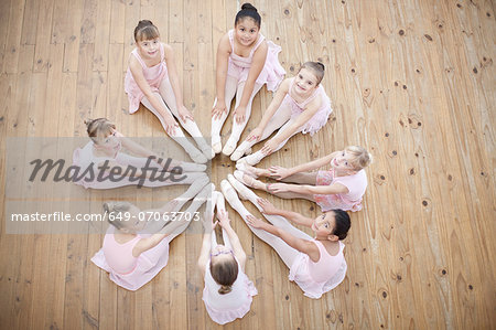 Elevated view of young ballerina in circle formation