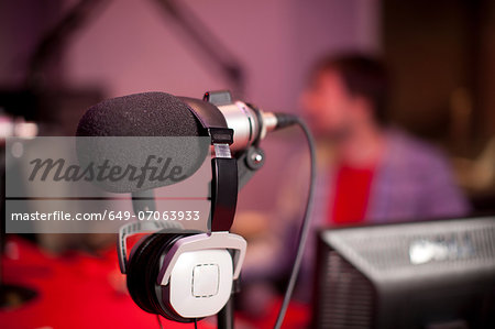 Microphone and headphones in recording studio