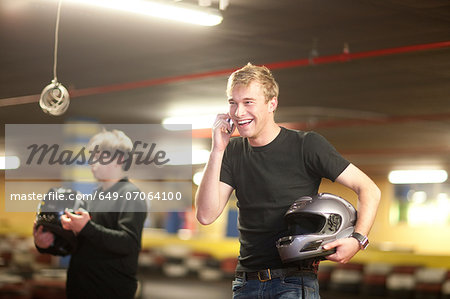 Young man and boy at go cart track
