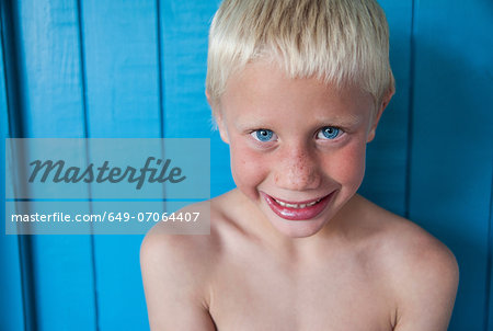 Boy with wide smile looking at camera