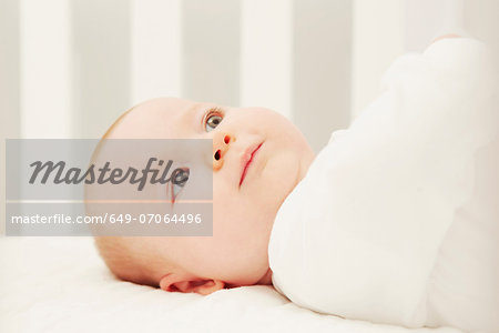 Baby in crib by herself