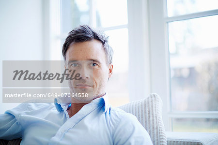 Portrait of businessman relaxing at home