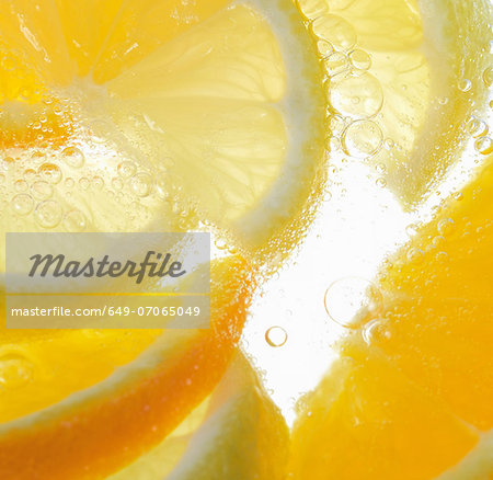 Orange wedges in bubbly water Orange wedges in bubbly water