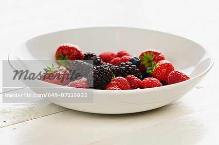 Strawberries, raspberries, blackberries and blueberries in bowl