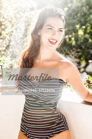 Young woman wearing striped swimsuit