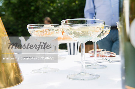 Champagne glasses on table, close up