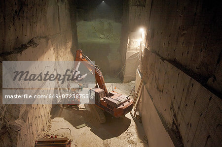 Excavator in a marble quarry