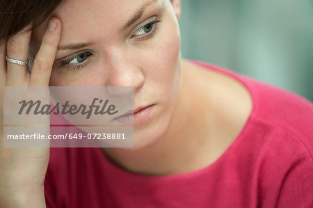 Young woman in deep thoughts
