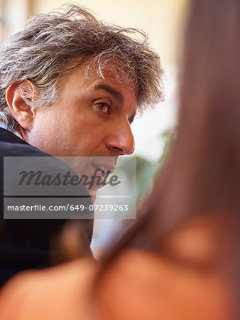 Mature businessman with grey hair, looking away
