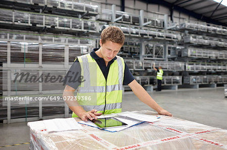 Warehouse worker preparing order in engineering warehouse