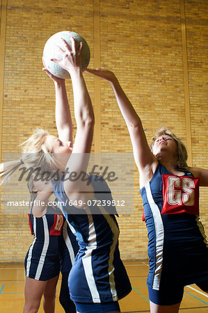 Young women playing netball