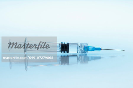 Disposable plastic medical syringe with attached hypodermic needle