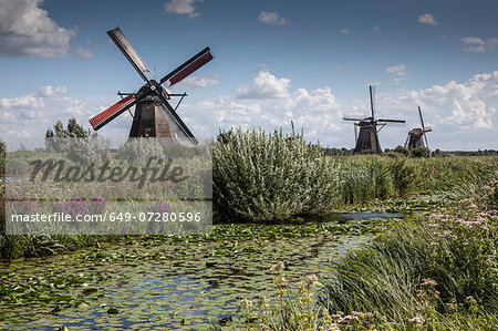 Windmills and canal marsh, Kinderdijk, Netherlands Windmills and canal marsh, Kinderdijk, Netherlands