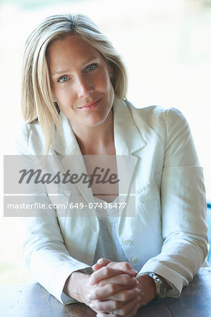 Portrait of mature woman wearing white jacket