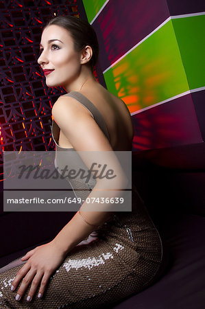 Portrait of glamorous young woman sitting Portrait of glamorous young woman sitting