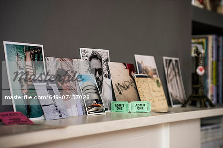 Living room mantelpiece with travel souvenirs and photographs Living room mantelpiece with travel souvenirs and photographs