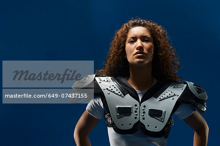 Female american football player in uniform, Stock image