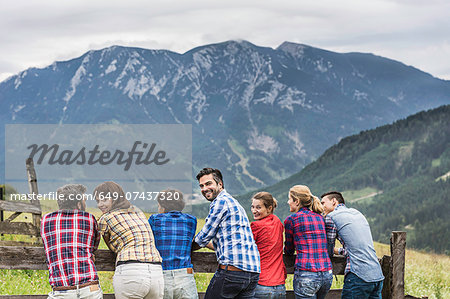 Back view of group of friends enjoying view, Tirol, Austria