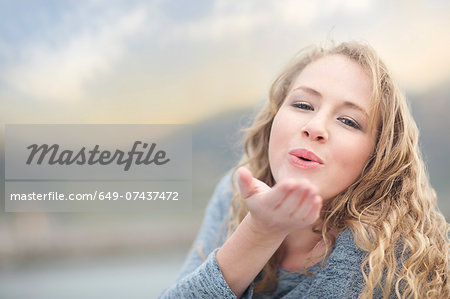 Woman blowing a kiss, Hout Bay, Cape Town, South Africa