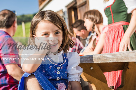 Portrait of girl at breakfast outside chalet, Tyrol, Austria