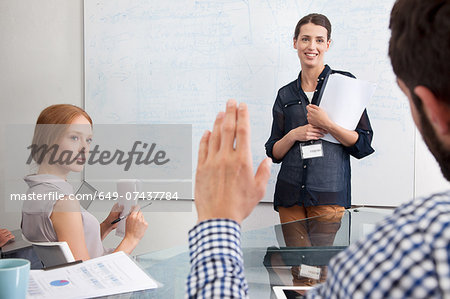 Businesswoman presenting to colleagues