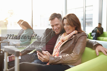 Mature couple in departure lounge