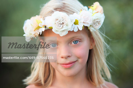 Portrait of girl with flower garland in her hair