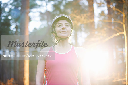 Portrait of mature woman wearing bicycle helmet