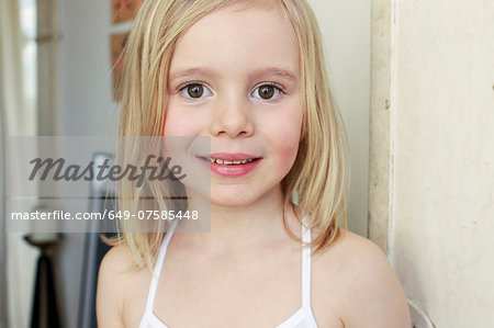 Portrait of innocent young girl in corridor