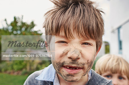 Boy with muddy face