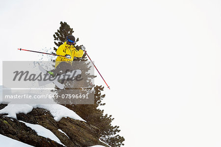 Mid adult male skier jumping mid air, Obergurgl, Austria