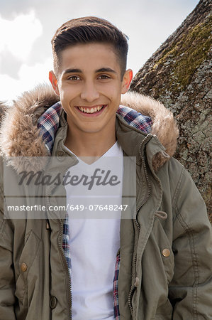 Portrait of teenage boy in parka jacket