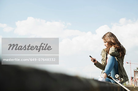 Young woman using cell phone