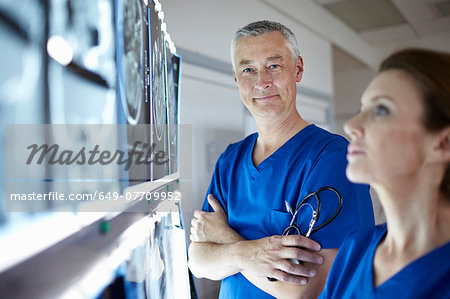 Portrait of radiologists with brain scans