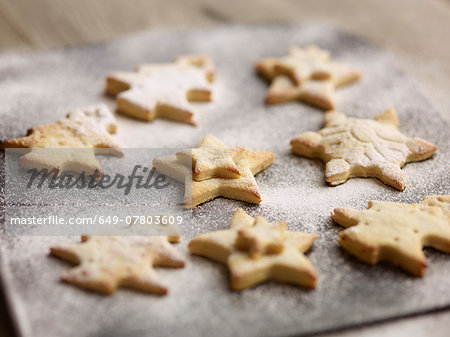 Close up of freshly baked christmas biscuits on baking tray