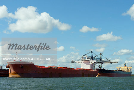 Huge ships moored in the rotterdam harbour, used for transporting coal and iron ore