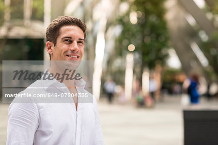 Confident young businessman at Broadgate Tower, London, UK