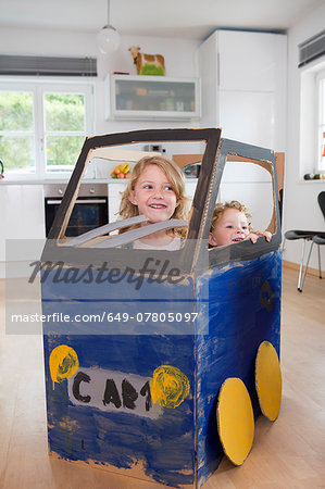 Two girls in homemade toy car