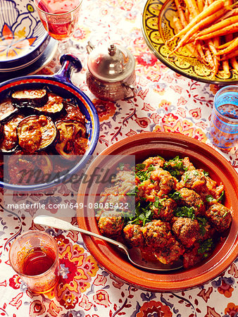 Still life of Moroccan kefta meatballs with eggplant and carrots