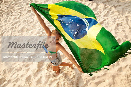 Overhead Portrait Of Young Woman Holding Brazilian Flag Whilst Dancing Ipanema Beach Rio De Janeiro Brazil Stock Photo Masterfile Premium Royalty Free Code 649