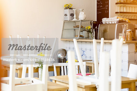 Cafe interior, closed, chairs on tables