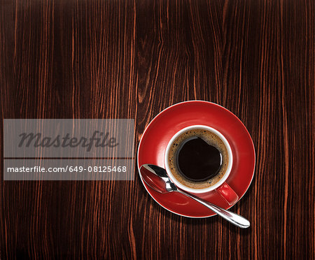 Overhead view of an espresso coffee on wooden table