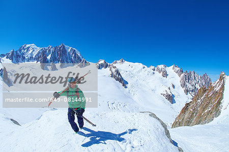 Mature male skier on ridge at Mont Blanc massif, Graian Alps, France