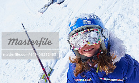 Girl with snow-covered ski goggles, Chamonix, France