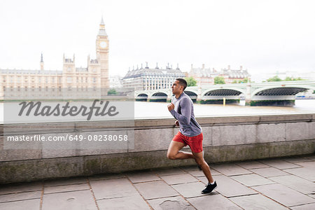 Male runner running on Southbank, London, UK