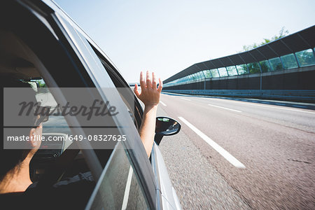 Woman travelling on highway, Garda, Italy