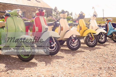 Colourful scooters parked in a row