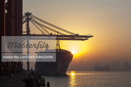 Container ship and cranes at port